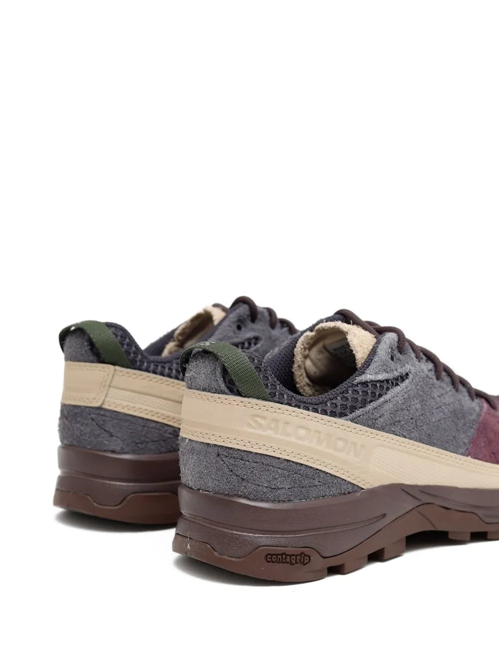 Grey suede lace-up trail shoe with Salomon logo, beige stripe and brown outsole