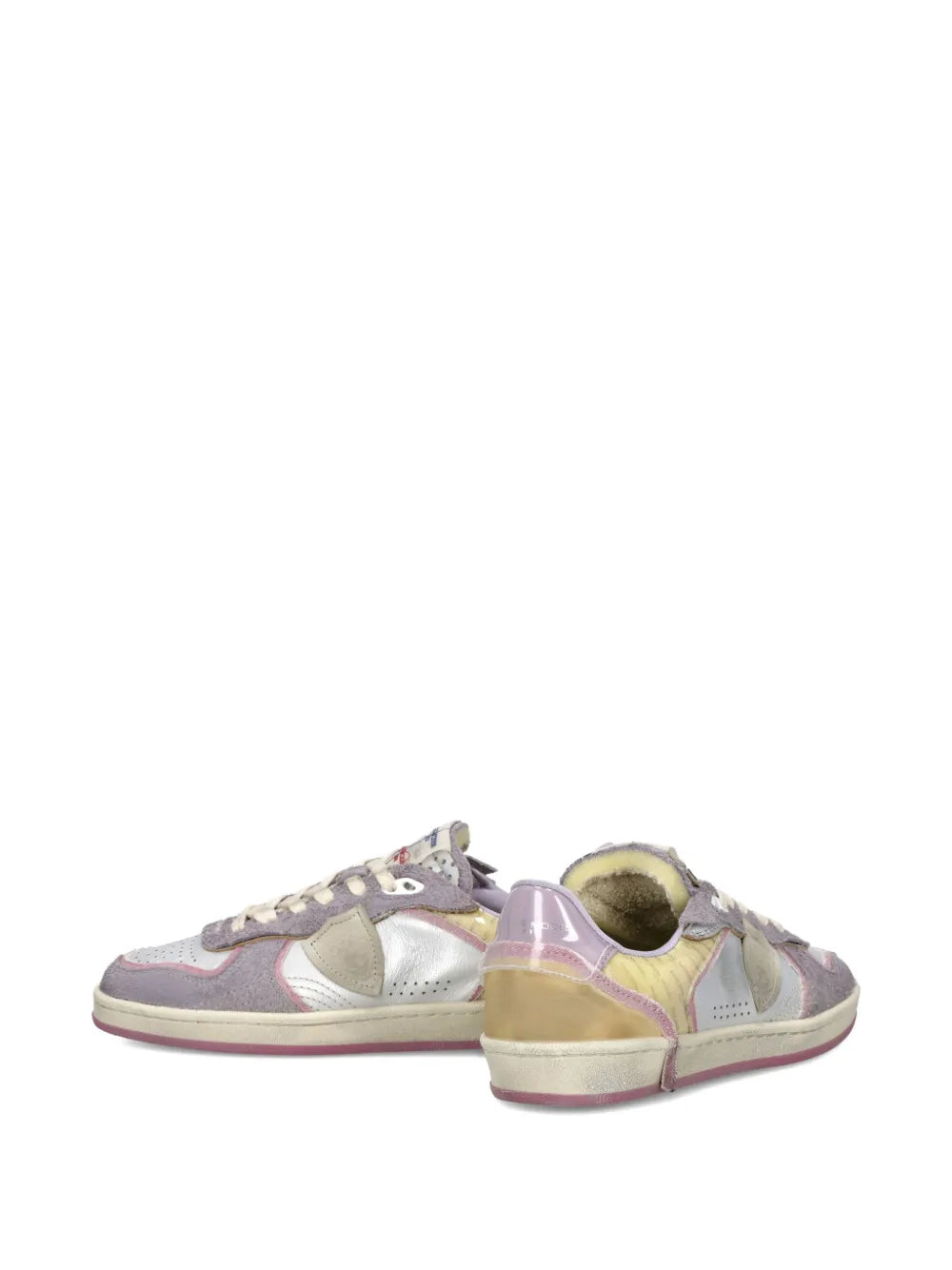 Low-top lace-up sneakers with colorful panels, white laces, and rounded toe profile