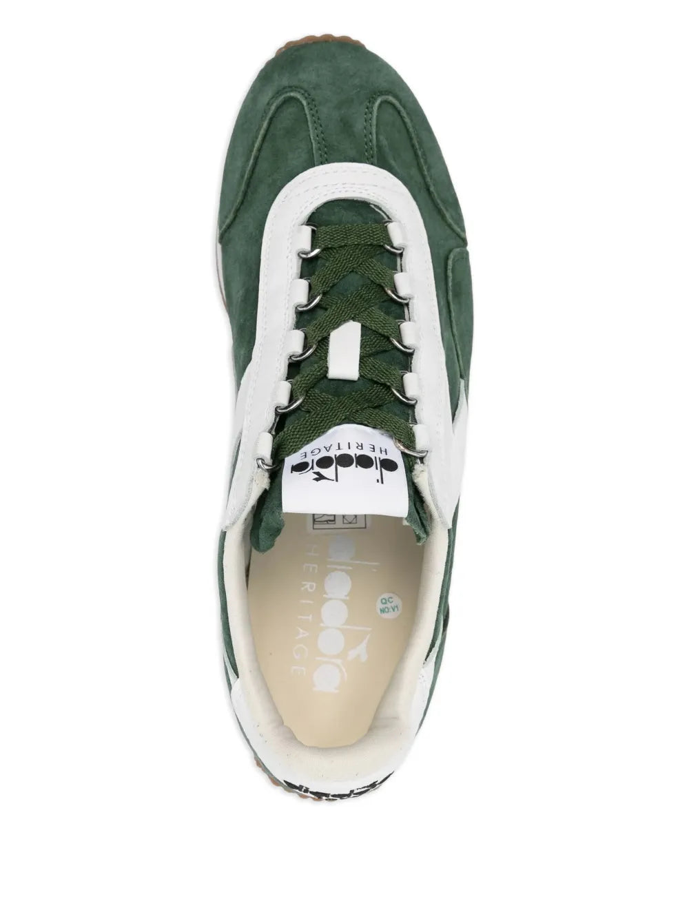 Green and white suede sneakers, lace-up front, visible tongue label.