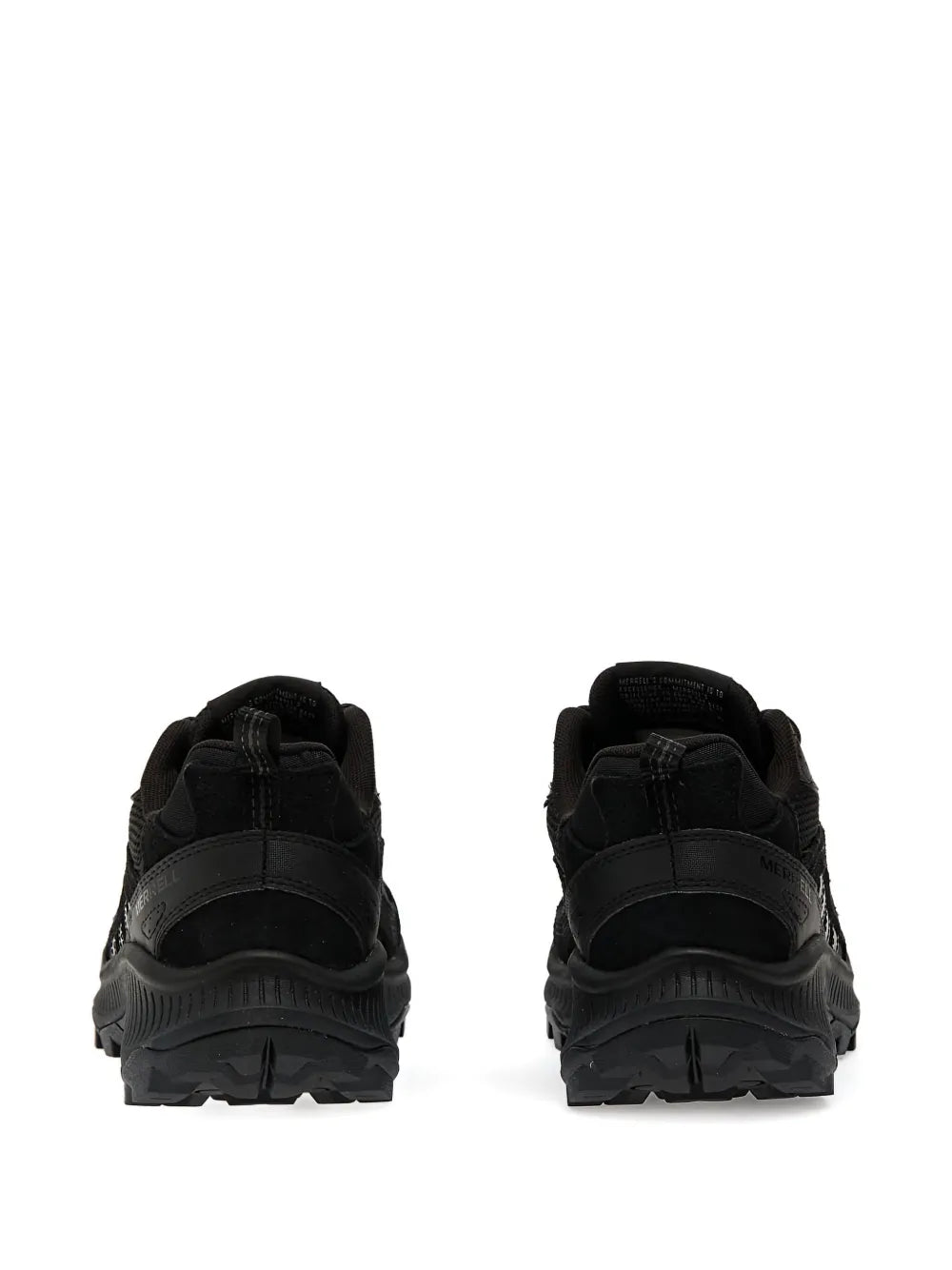 Black sneakers back view, padded heel and textured overlays on chunky sole