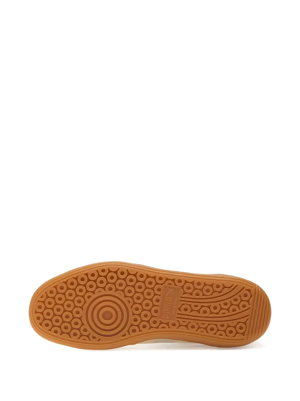 Yellow suede sneaker outsole with patterned traction tread