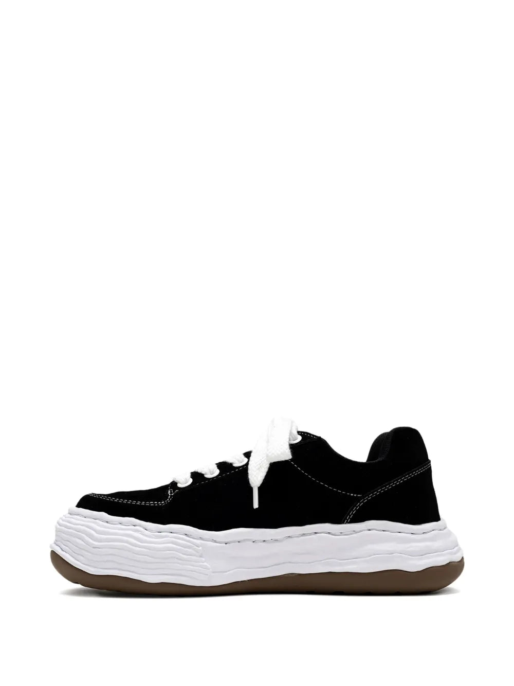 Black low-top sneakers with white laces and thick white sole, front view
