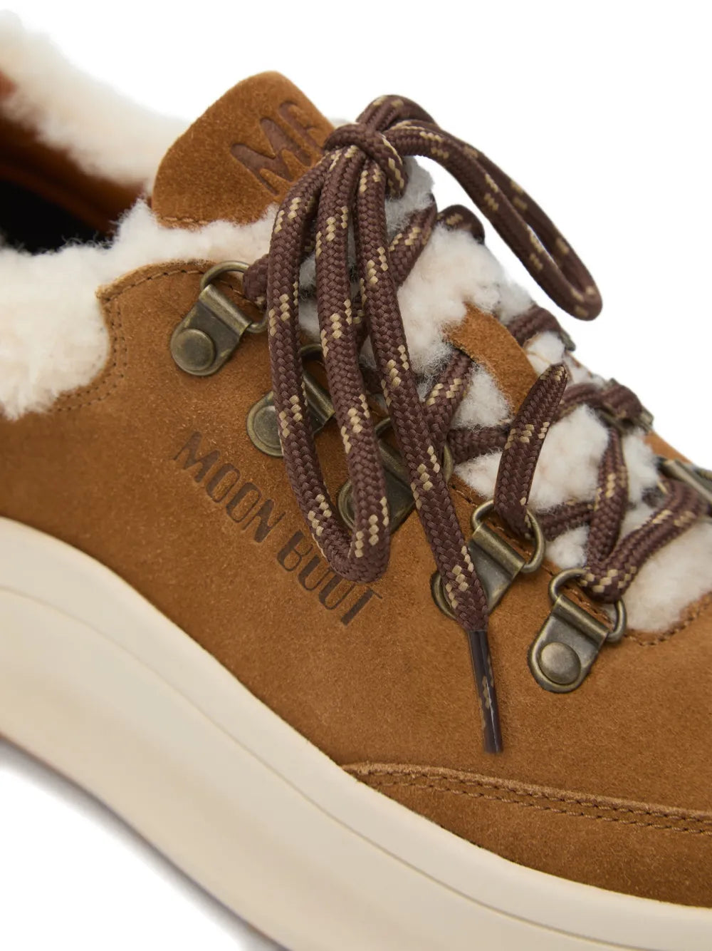 Brown Moon Boot Moon247 suede sneaker close-up with lace-up eyelets and faux shearling
