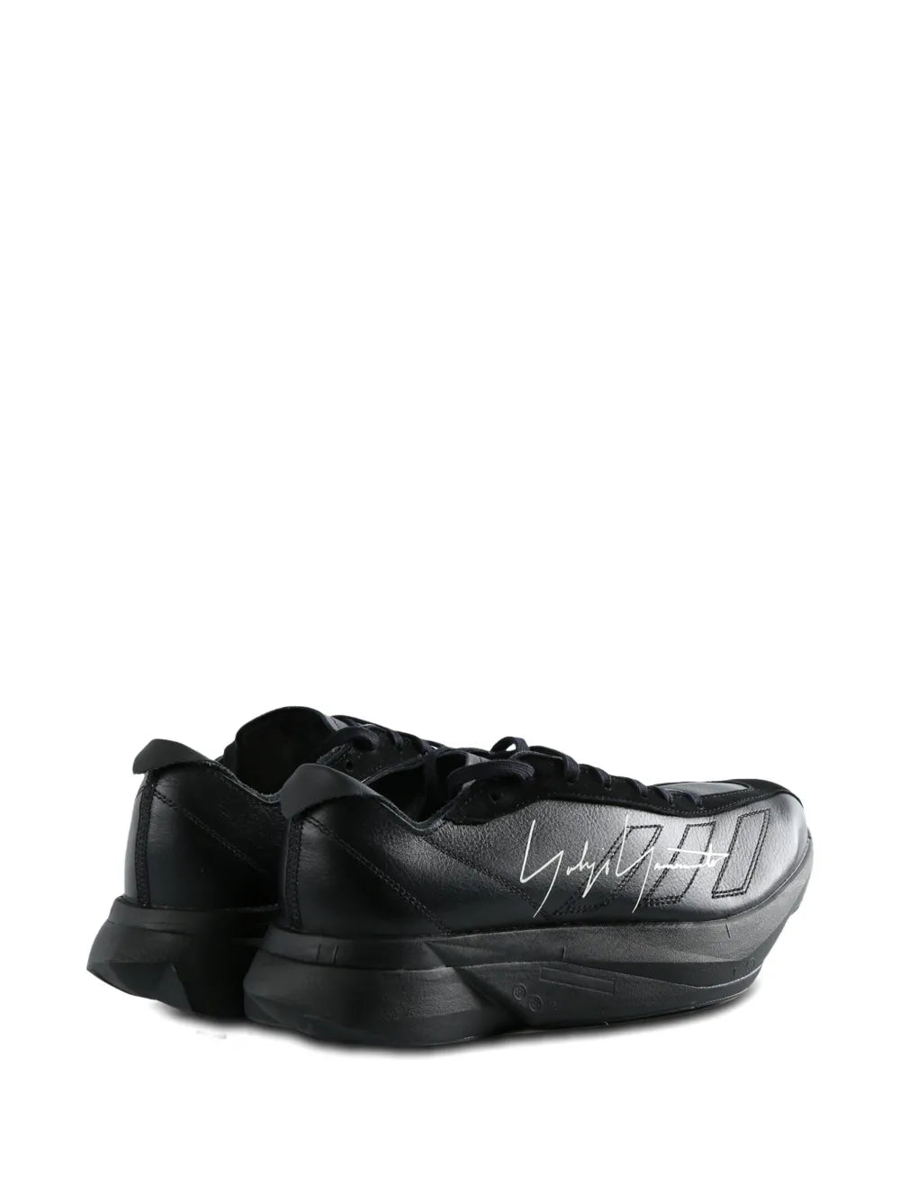 Black leather lace-up trainers with signature-style heel and sculpted side panels.