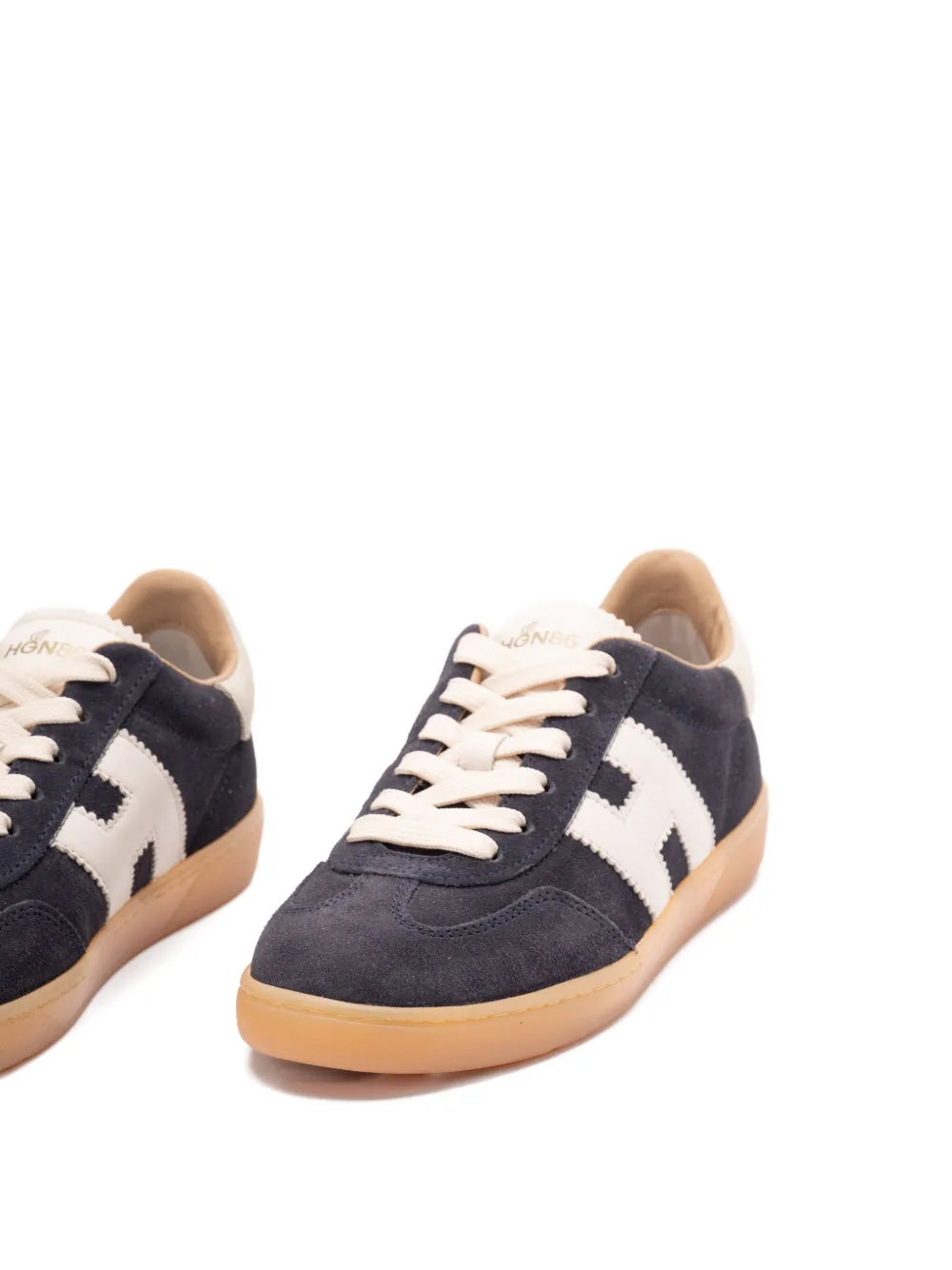 Blue leather trainers with white logo stripes and beige laces, low-top