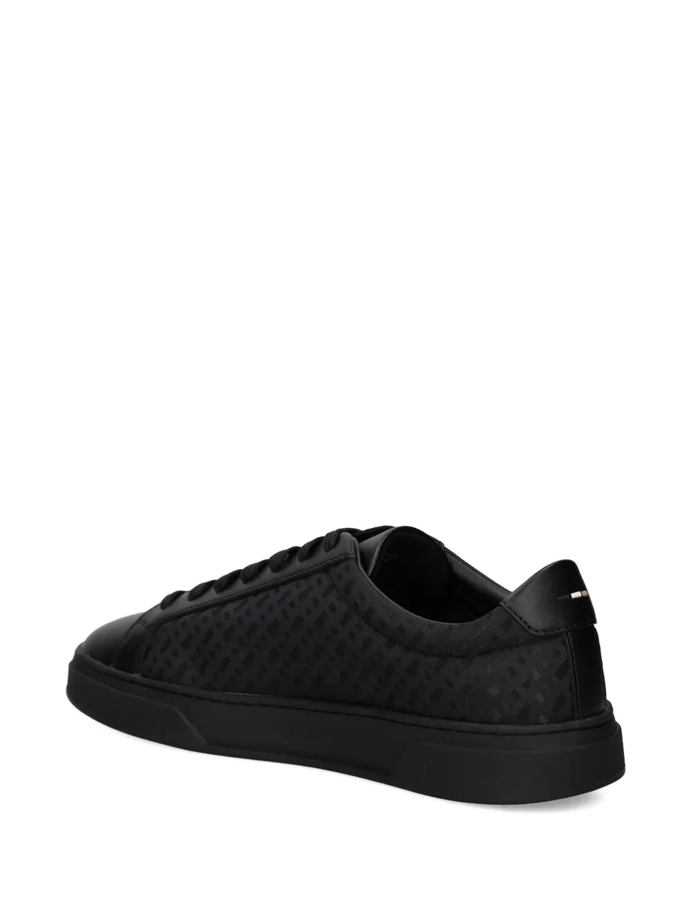 Black patterned leather sneakers from heel side, lace-up and rubber cup sole