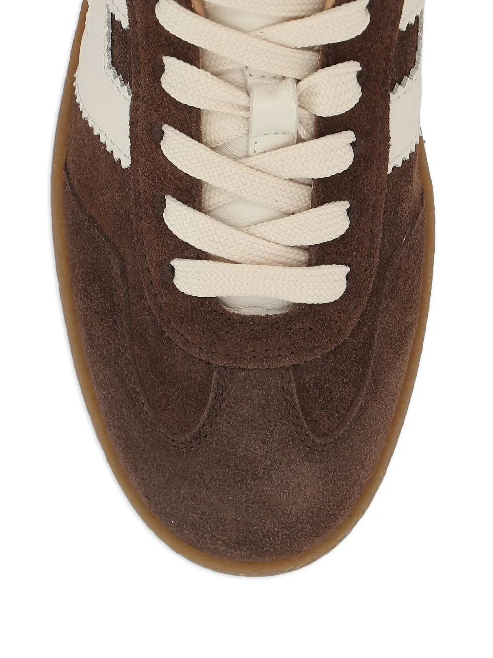 Dark brown suede sneaker upper close-up with white laces and side logo