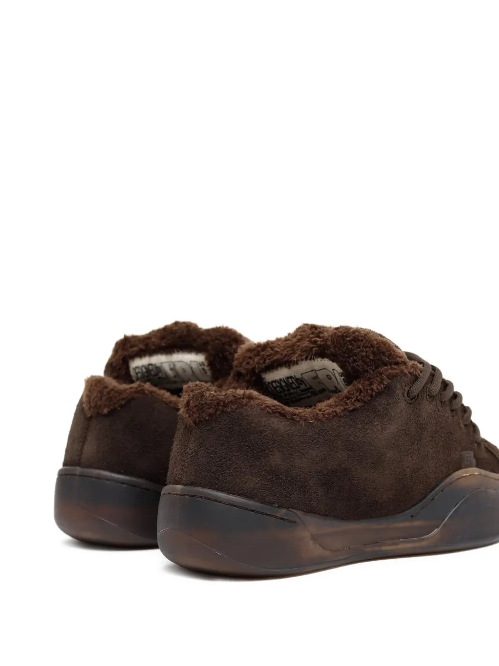 Dark brown suede sneakers shown from side, lace-up design with rubber sole