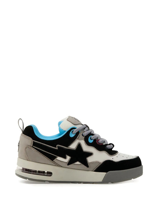 Low-top lace-up sneakers in gray and black with large white star and blue lining