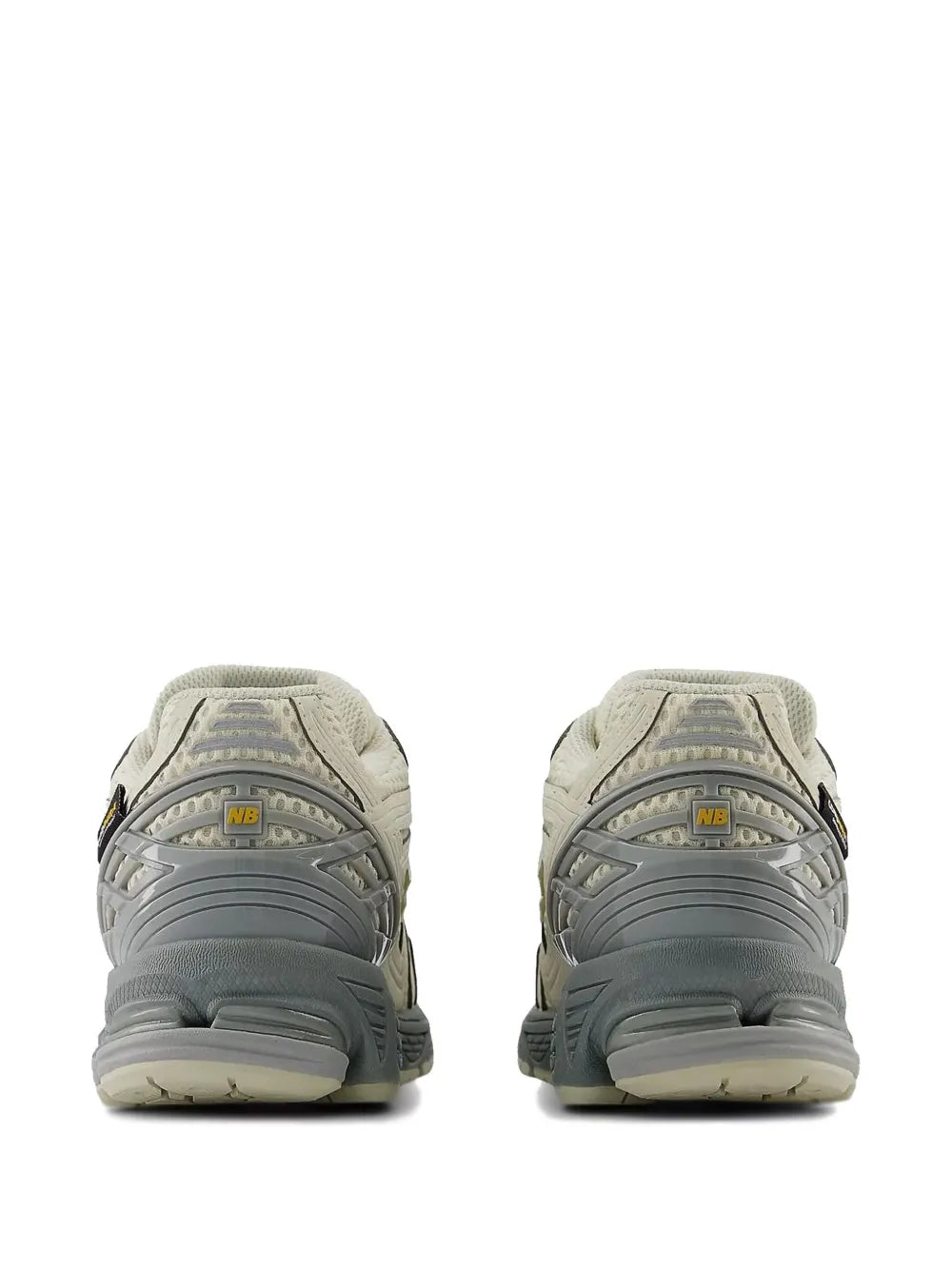 Off-white sneakers rear view with NB heel logo, padded collar, and gray sole