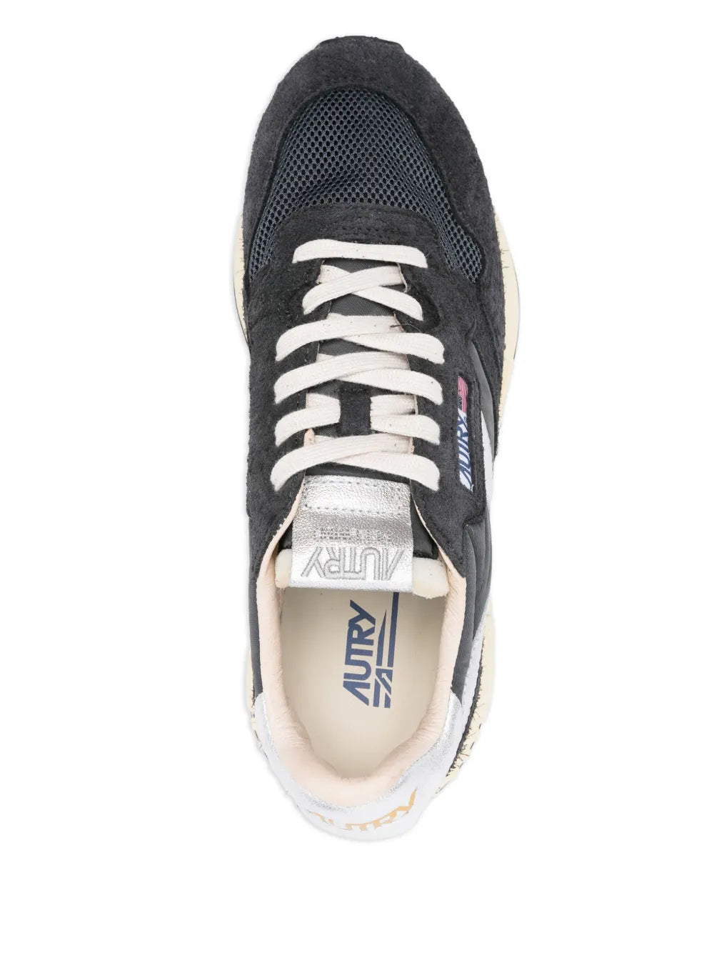 Black suede lace-up sneakers with white laces and logo patch on the tongue