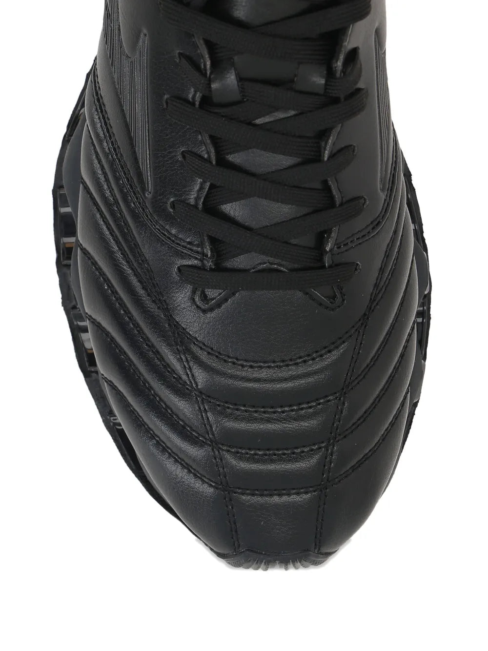 Black leather low-top sneaker front close-up with lace-up and stitched panel details