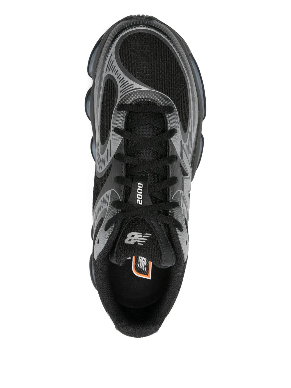 Black sneakers with '2000' branding on tongue and blue-cushioned sole