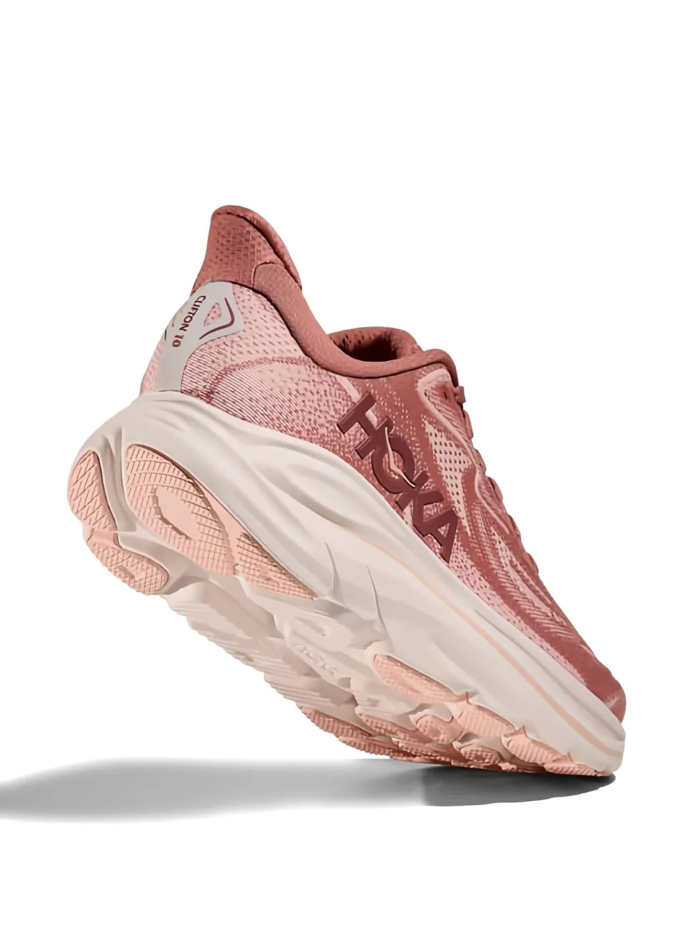 Hoka lace-up sneakers with blush pink upper and thick white cushioned sole