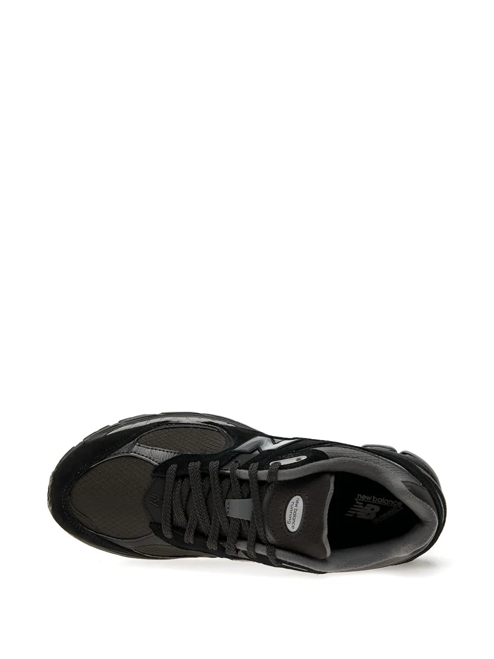 Black New Balance 2002R suede trainers, toe view with lace-up vamp