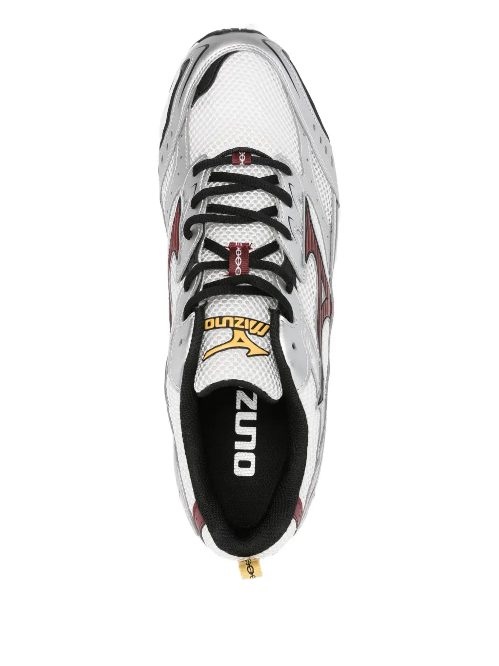 Mizuno Nimbus white sneakers, top view with black laces and branding on tongue