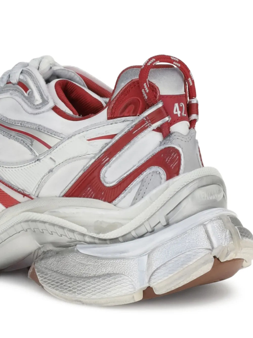 Balenciaga Runner 2 sneakers, close-up, white leather with red strap and treaded sole