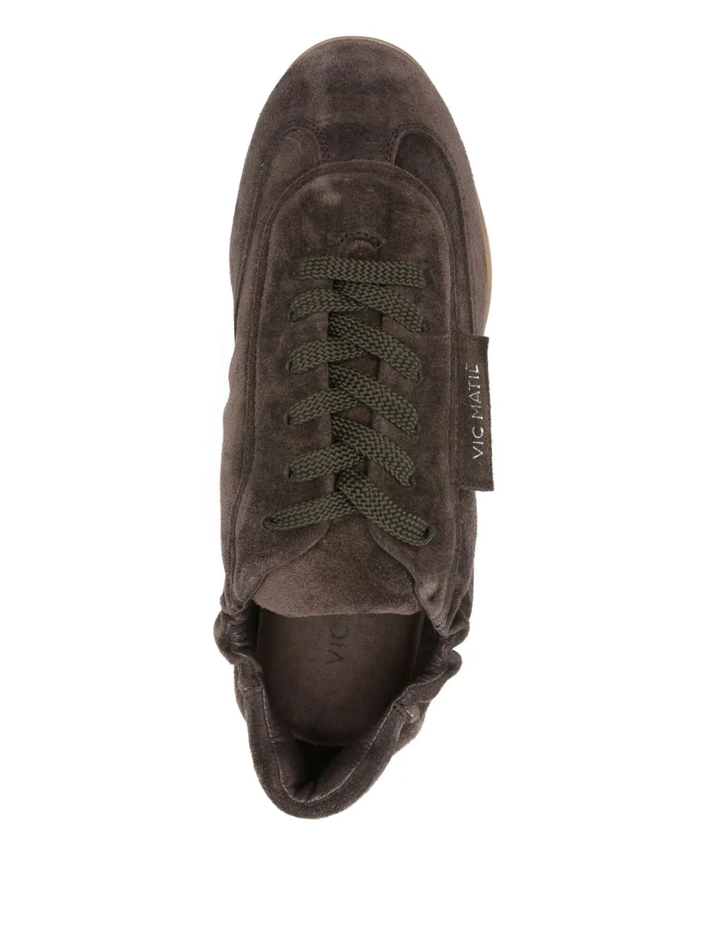Dark brown suede lace-up trainer top view with laces and Vic Matie tongue branding