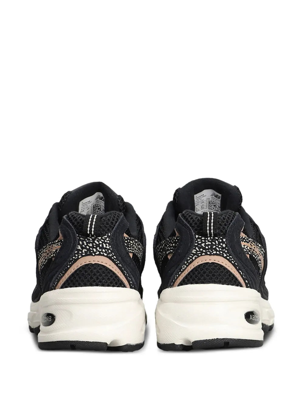 Black mesh-panel trainers, rear view with white heel sole and New Balance N accents