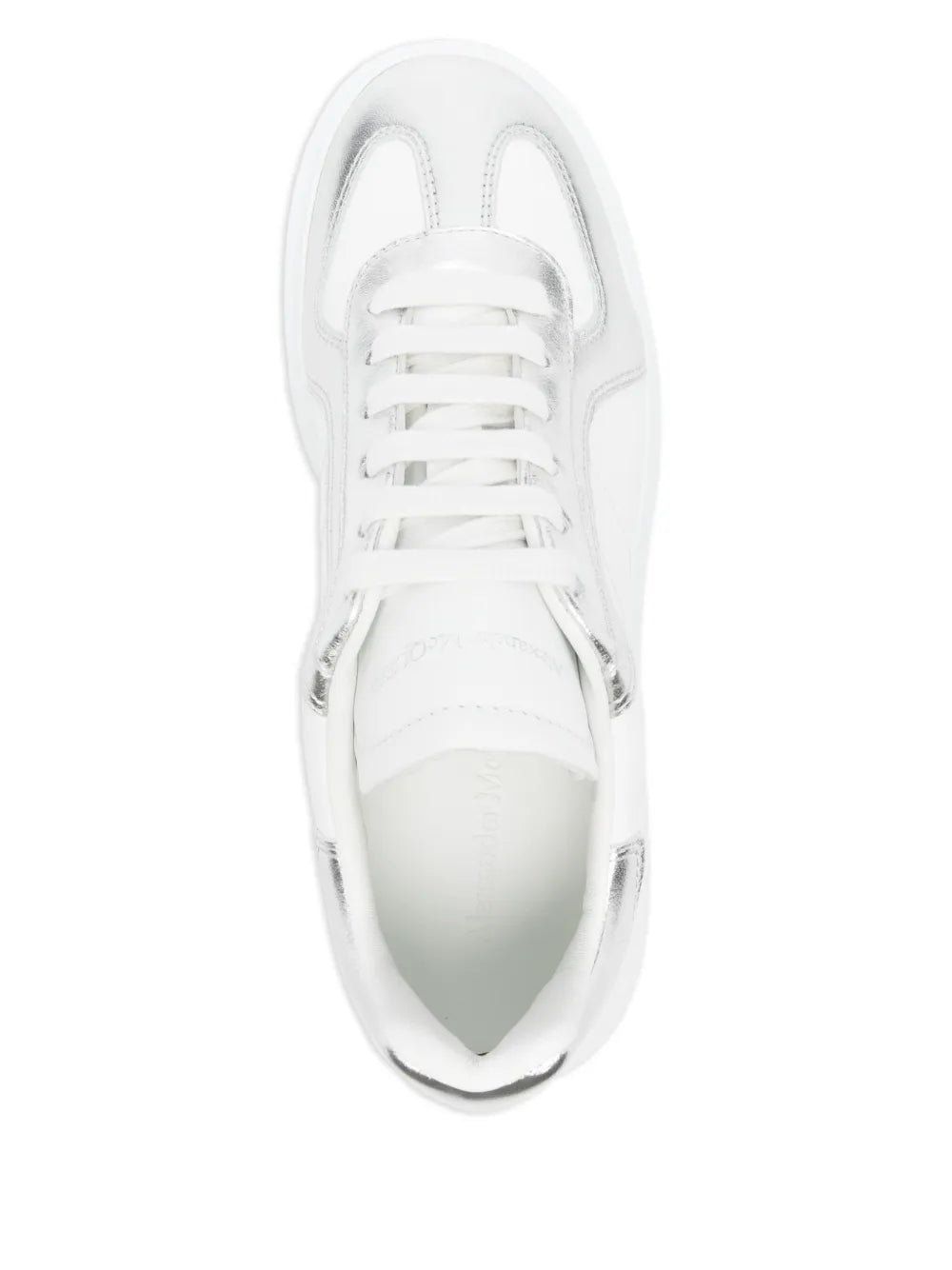 White leather lace-up sneakers with textured toe cap and thick sole