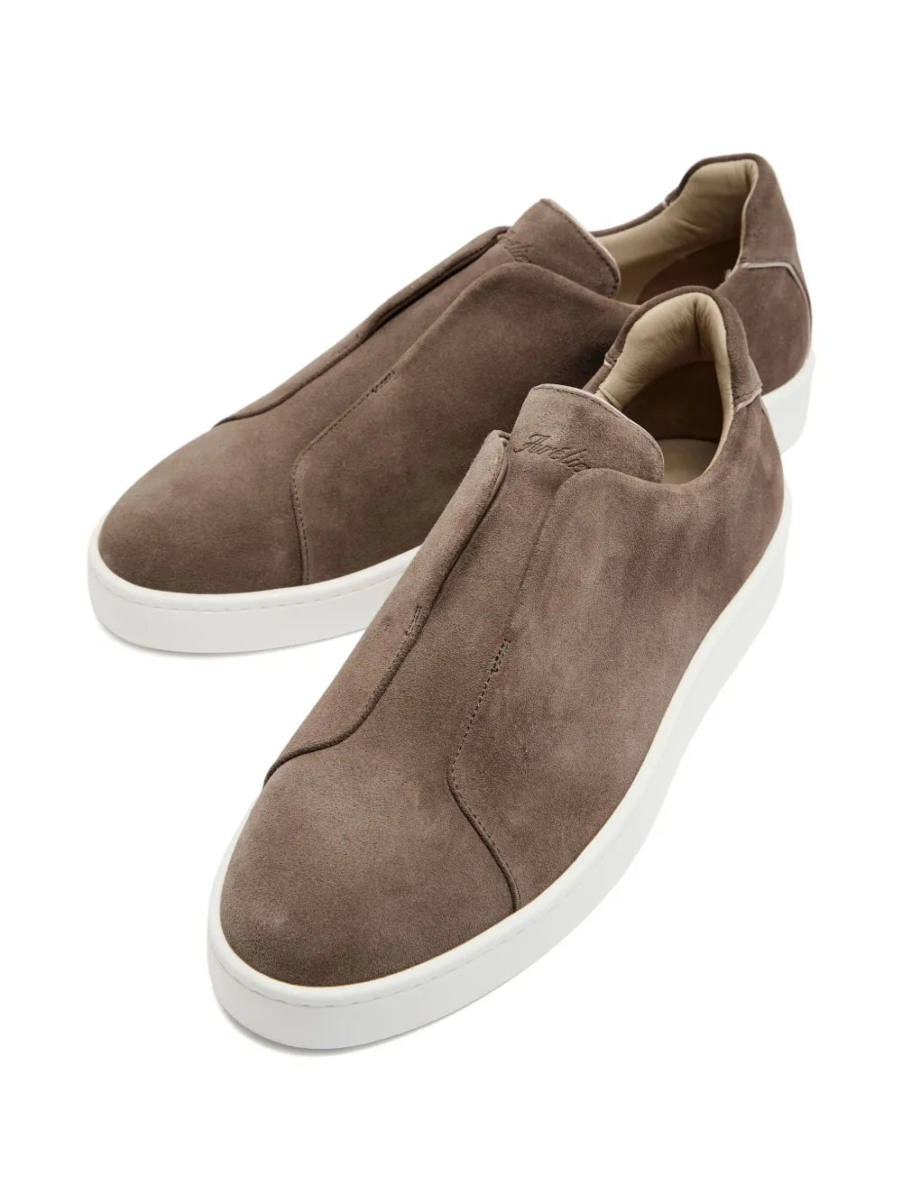 Taupe suede sneakers with cushioned collar and white platform sole