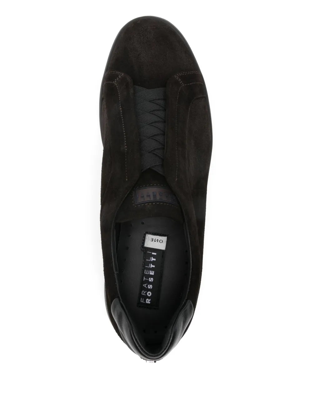 Dark-brown suede sneaker interior view with lace-up panel and insole label