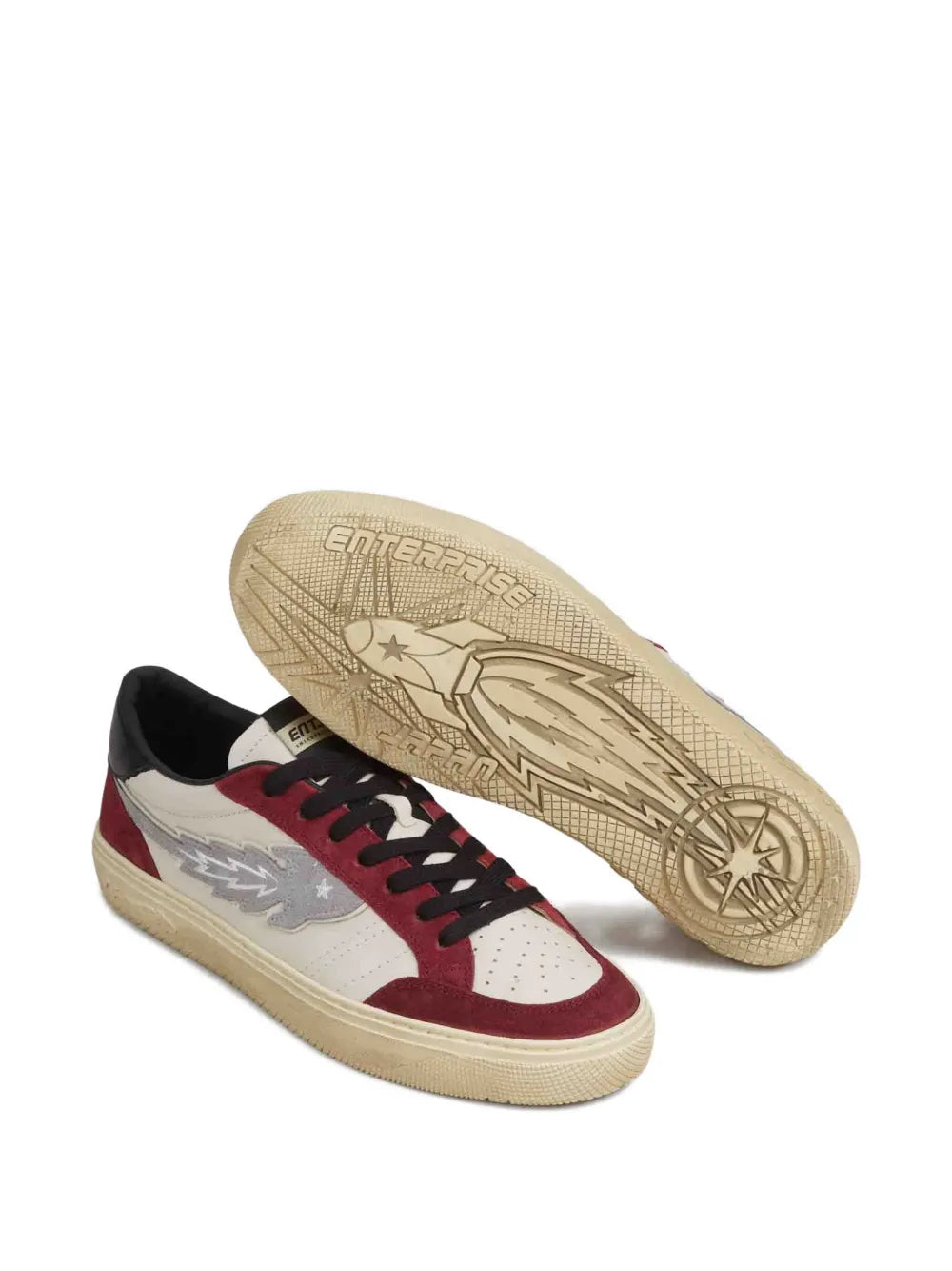 Lace-up sneakers with textured light-gum sole showing tread pattern
