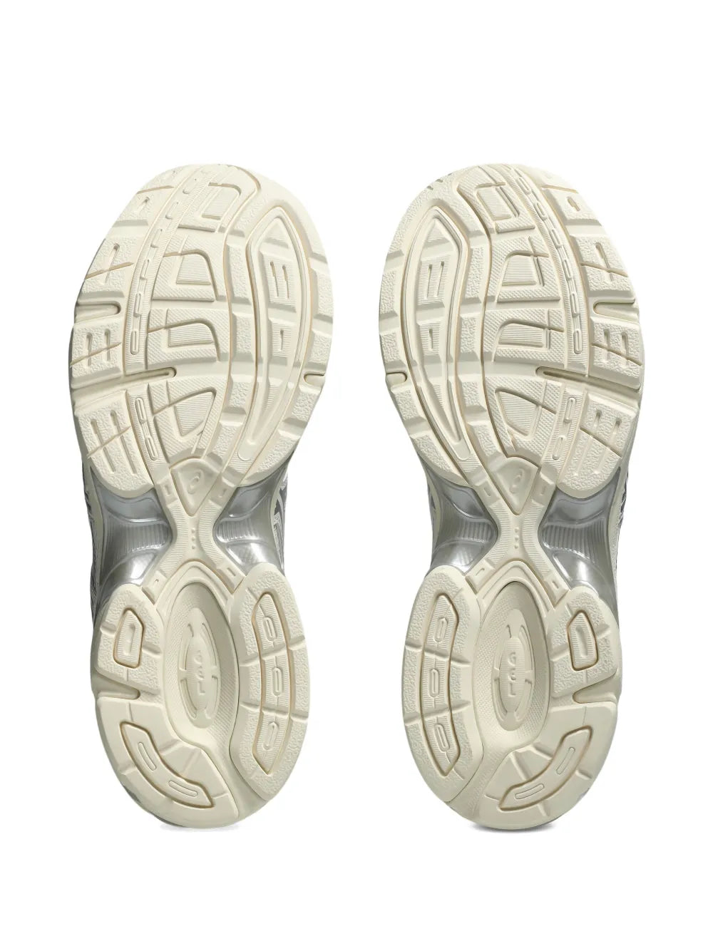 Sole view of cream and light gray Asics sneakers with tread pattern