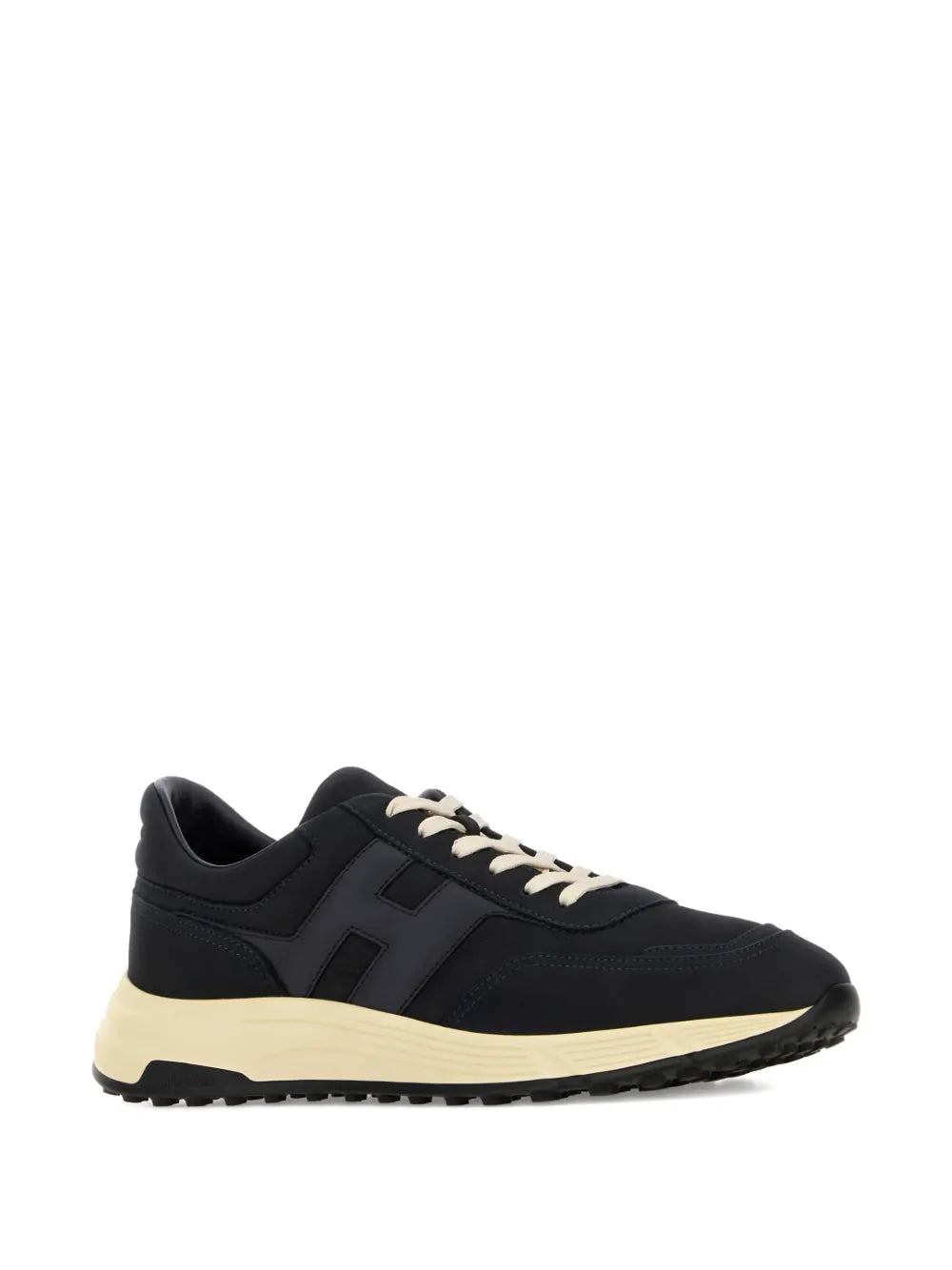 Suede low-top sneakers with lace-up eyelets, dark upper, and cream sole