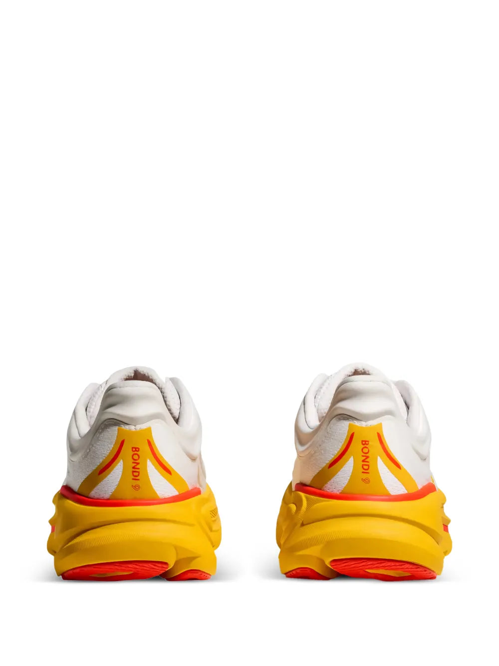 White low-top sneakers, rear view, orange lining, thick yellow sole with red outsole