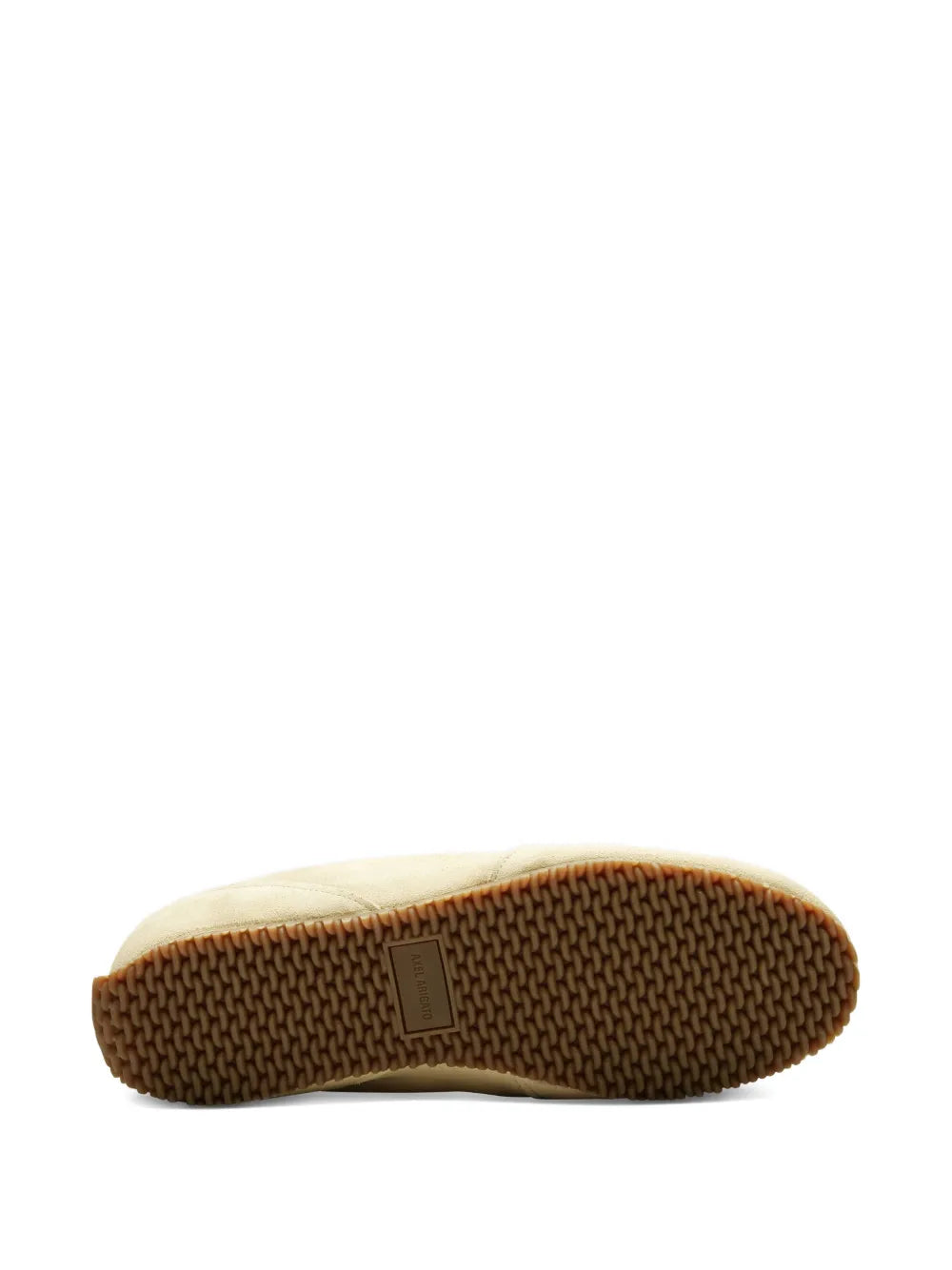 Light yellow sneaker outsole with textured rubber tread and side branding patch