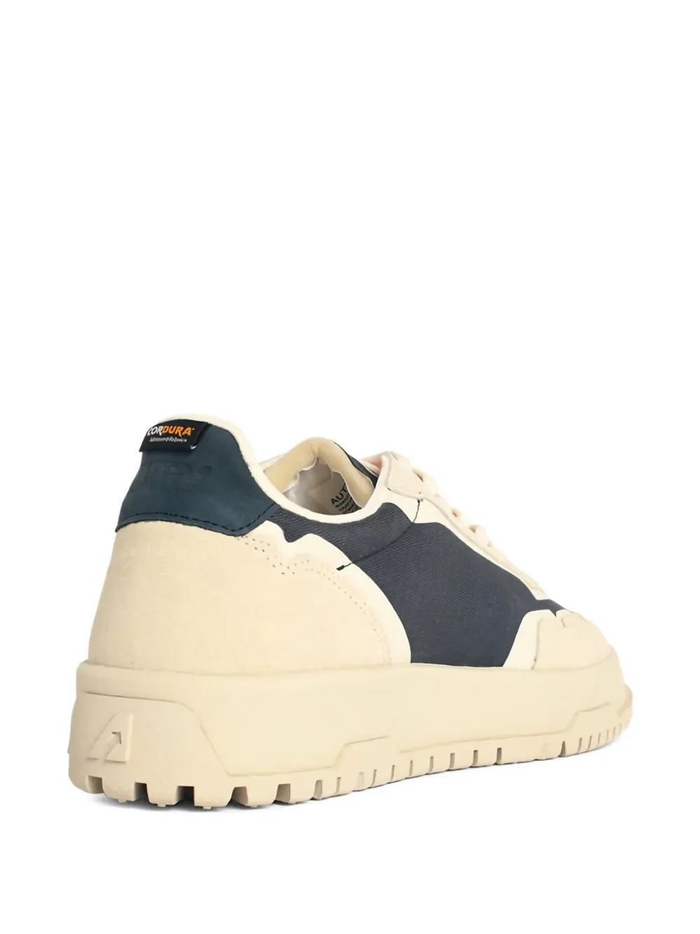 Suede lace-up sneakers with navy heel panel and cream upper, thick tread rubber sole