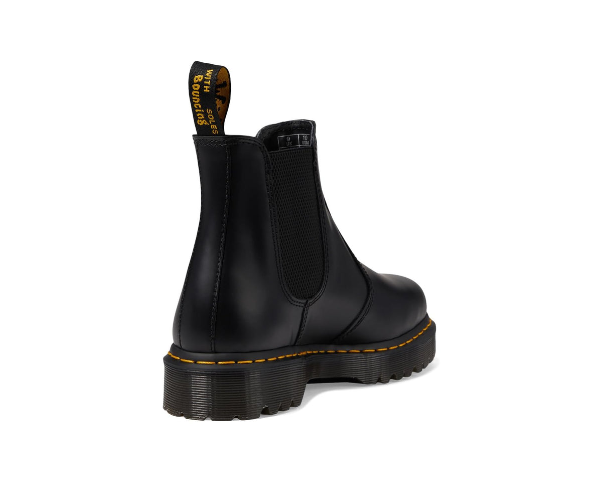 Black smooth leather chelsea boots rear three-quarter view with stacked tread sole