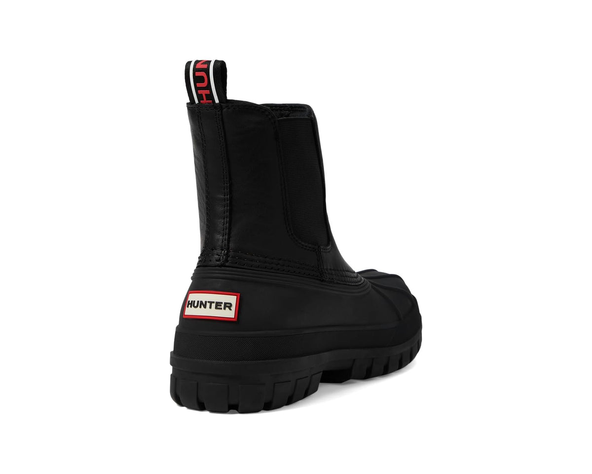 Black Hunter rain boots, angled side view with pull tab and lug tread sole
