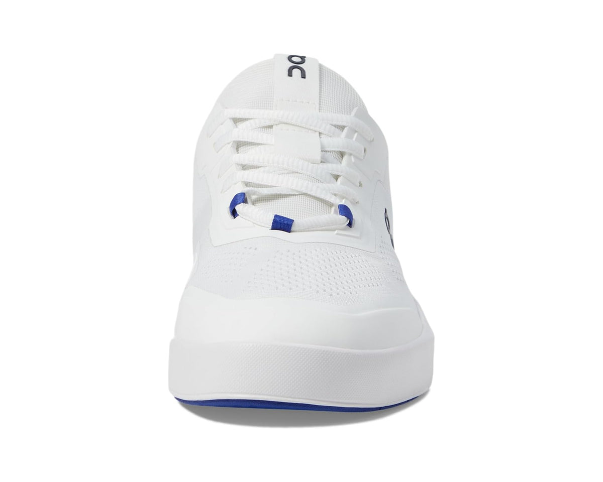 Men's white sneaker profile with blue lace aglets and logo patch