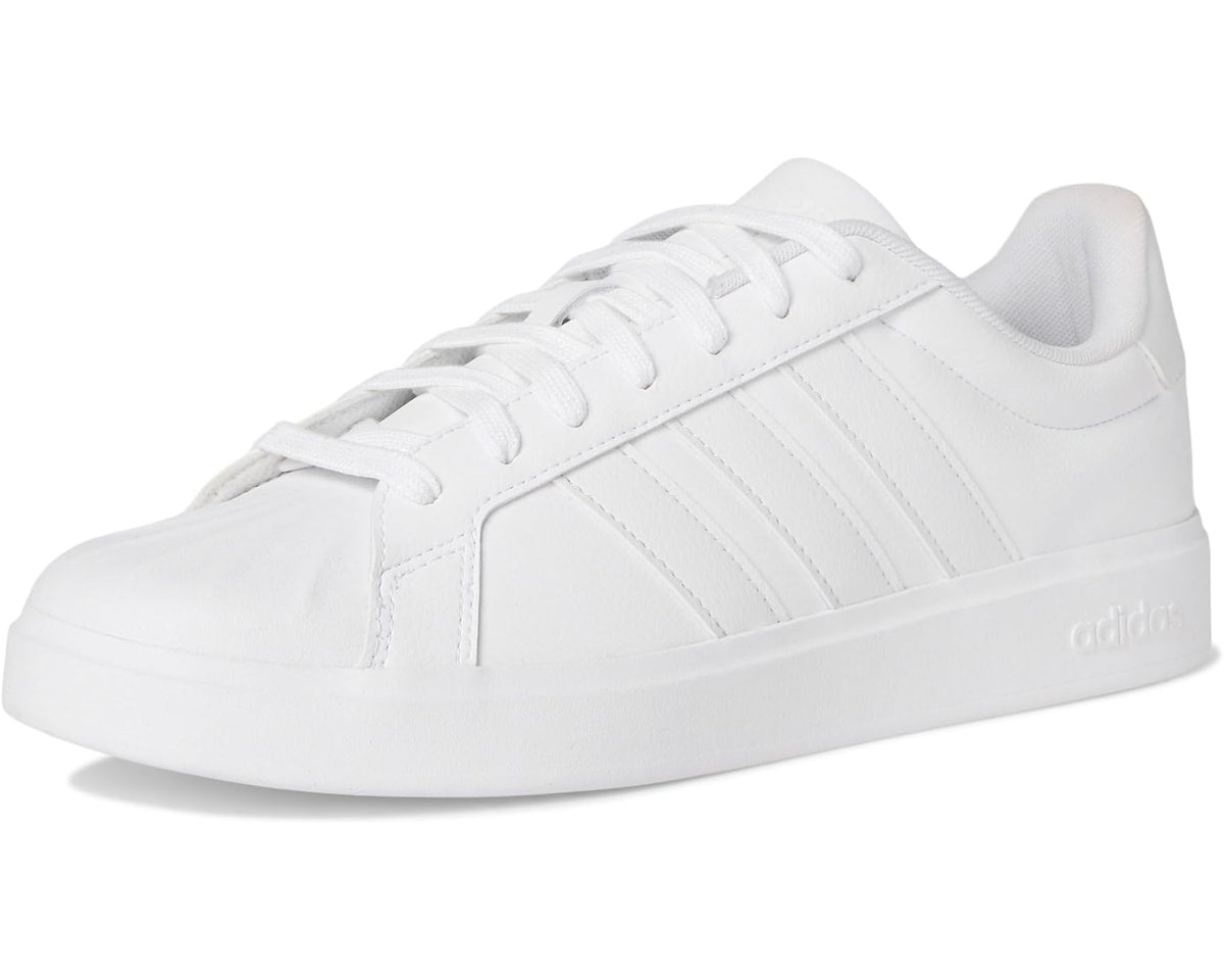 White adidas low-top sneakers with clean leather upper and lace-up closure