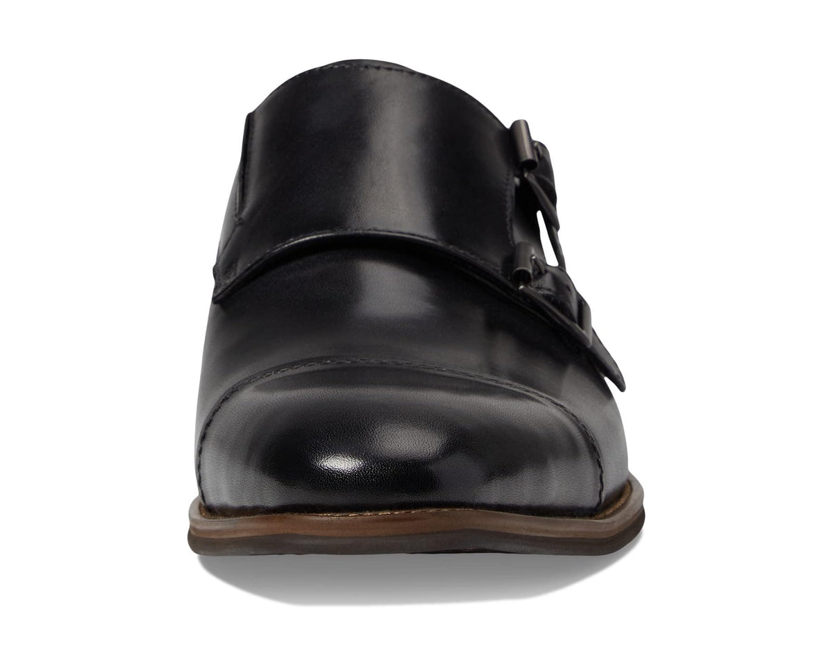 Men's black leather dress shoe with buckle detail and brown sole