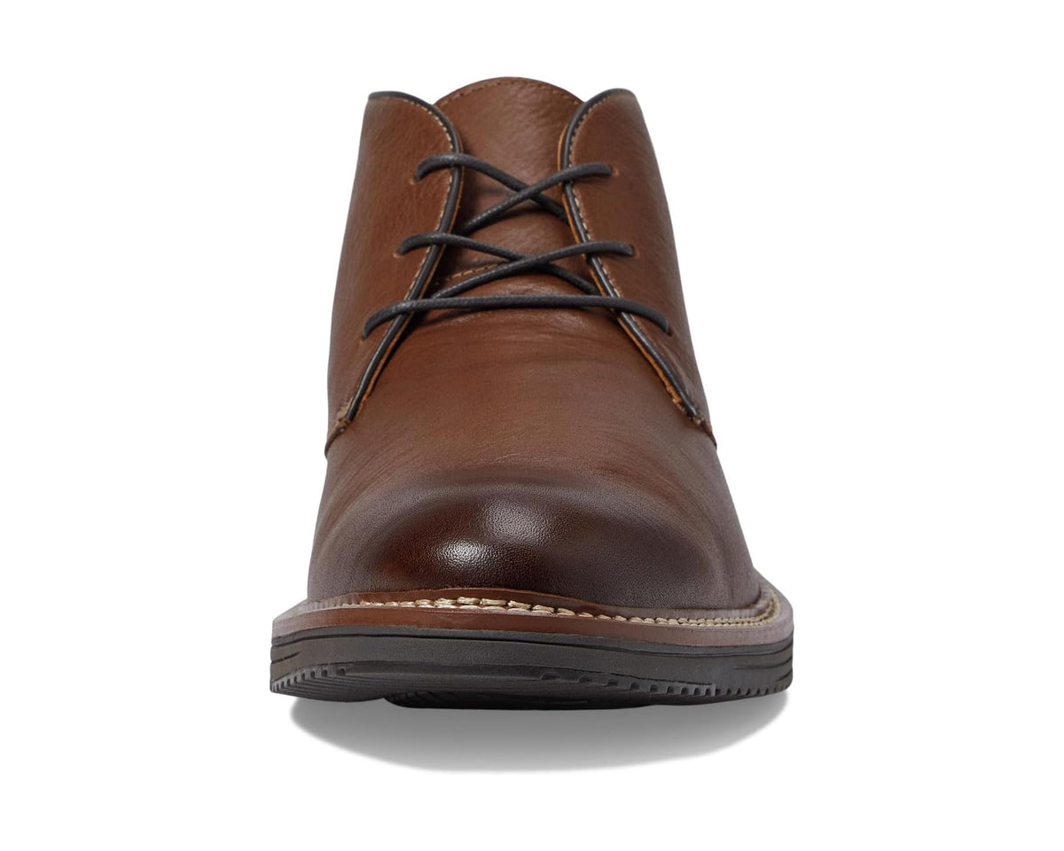 Tan chukka boots front view with lace-up top and cushioned-looking leather vamp.