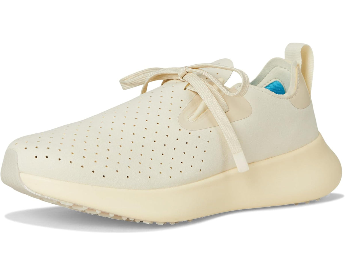 Unisex Native shoes 3/4 view with lace-up front and perforated toe in bone white