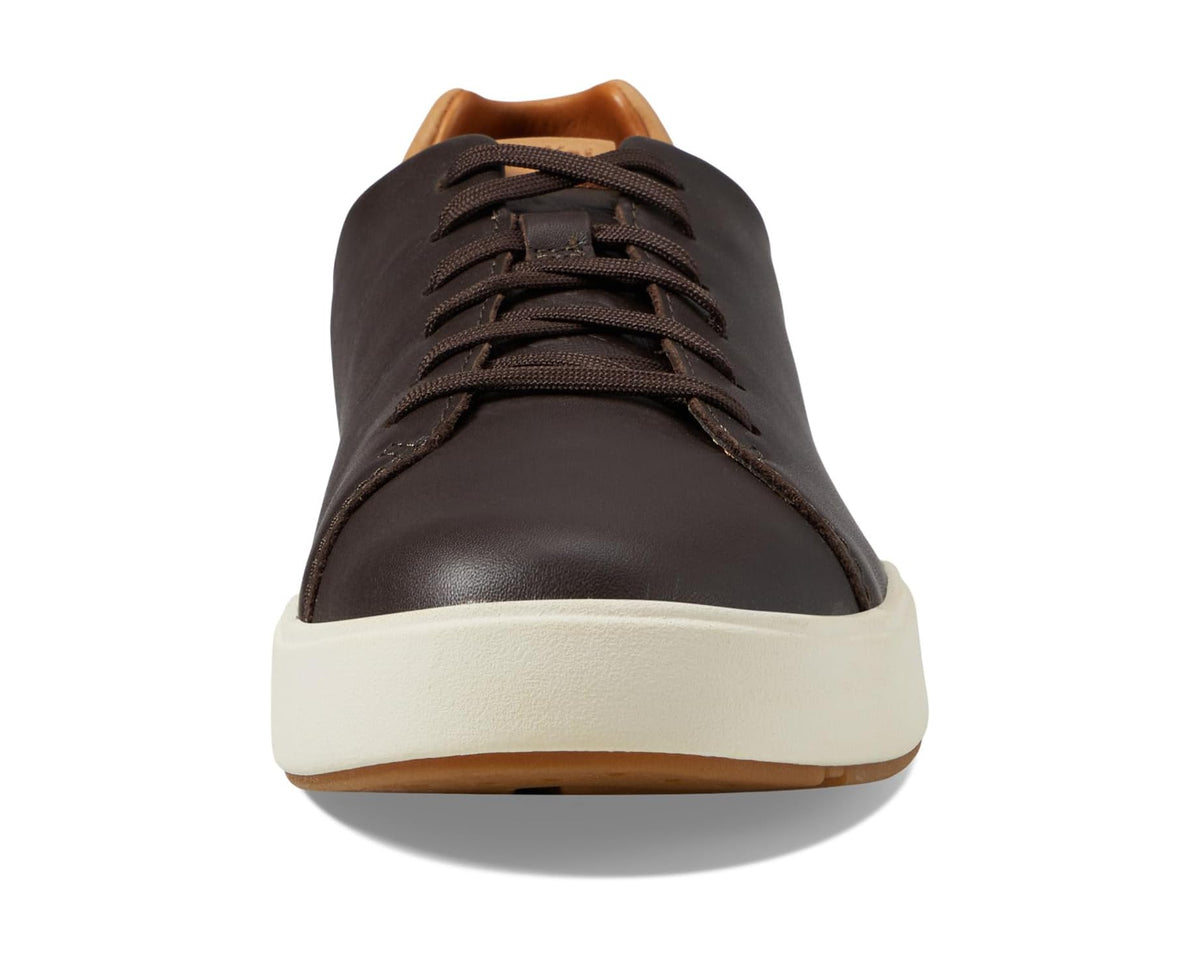 Men's dark brown front lace-up sneaker with white sole and tan collar lining
