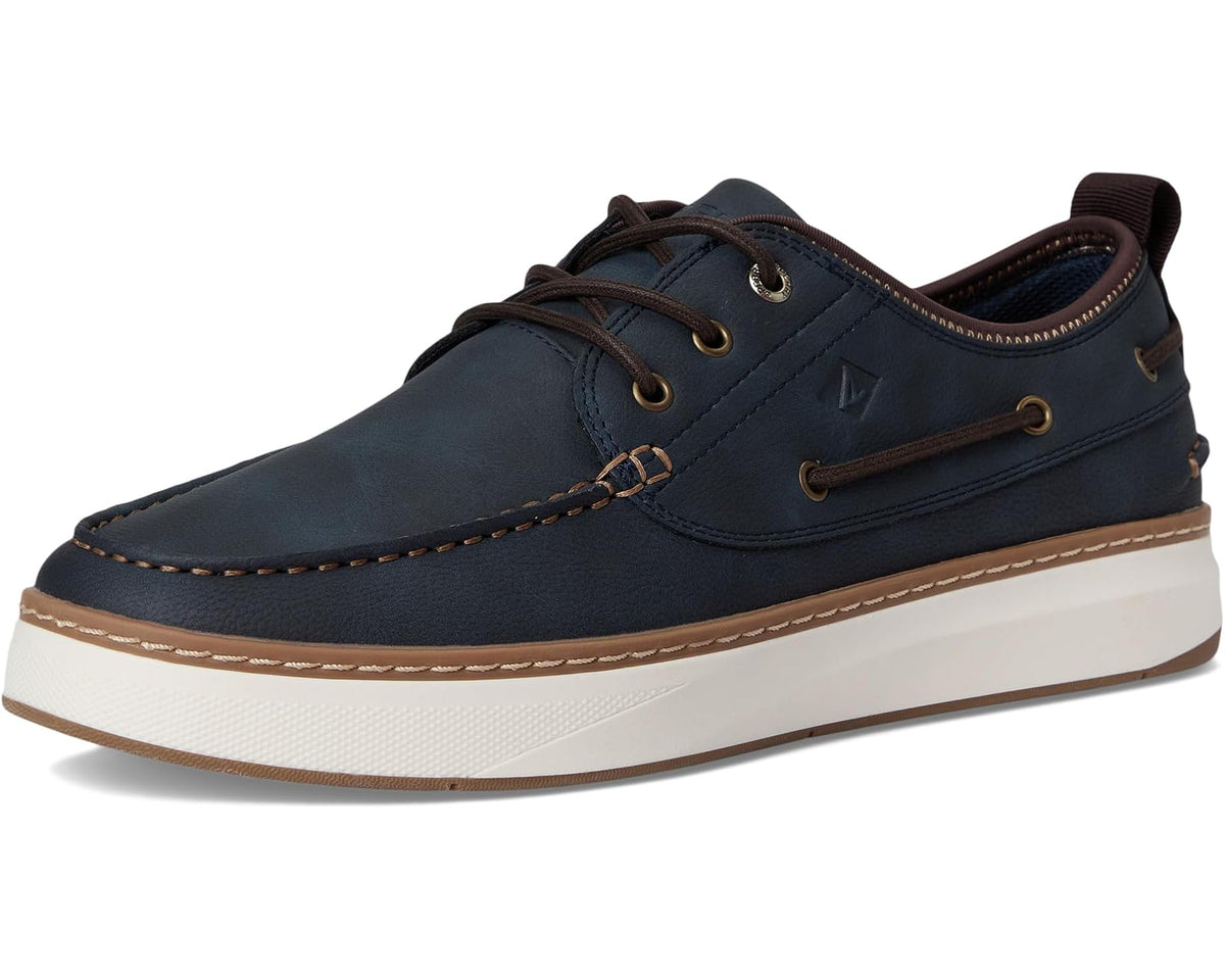 Men's navy moccasin boat shoes with moc toe and tan welt trim