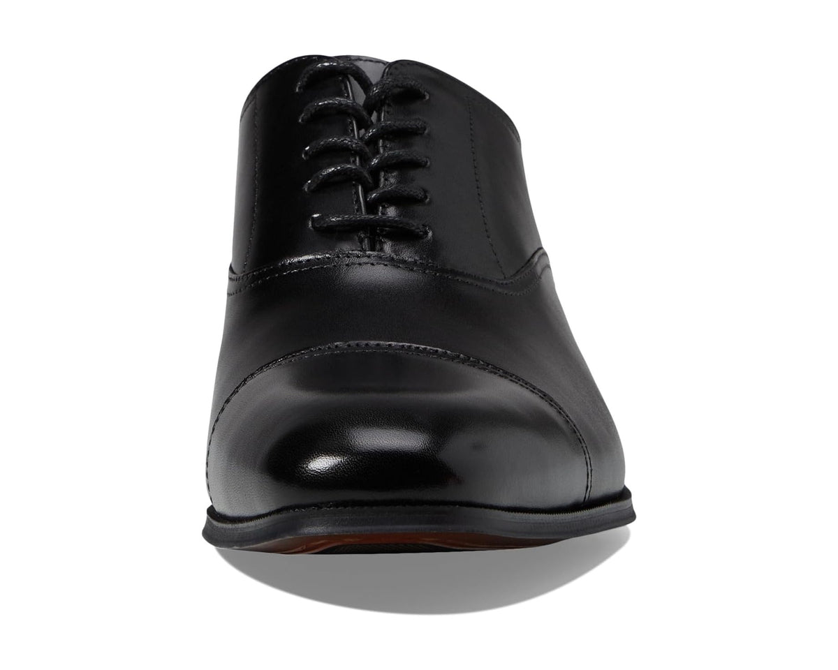 Men's Florsheim cap toe Oxford shoes, black smooth leather, front lace-up view