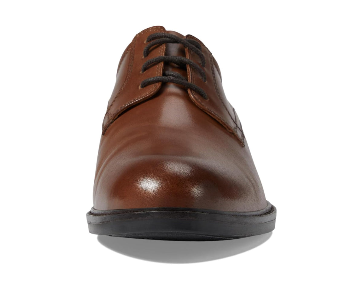 Men's tan leather lace-up dress shoe front view with glossy toe cap