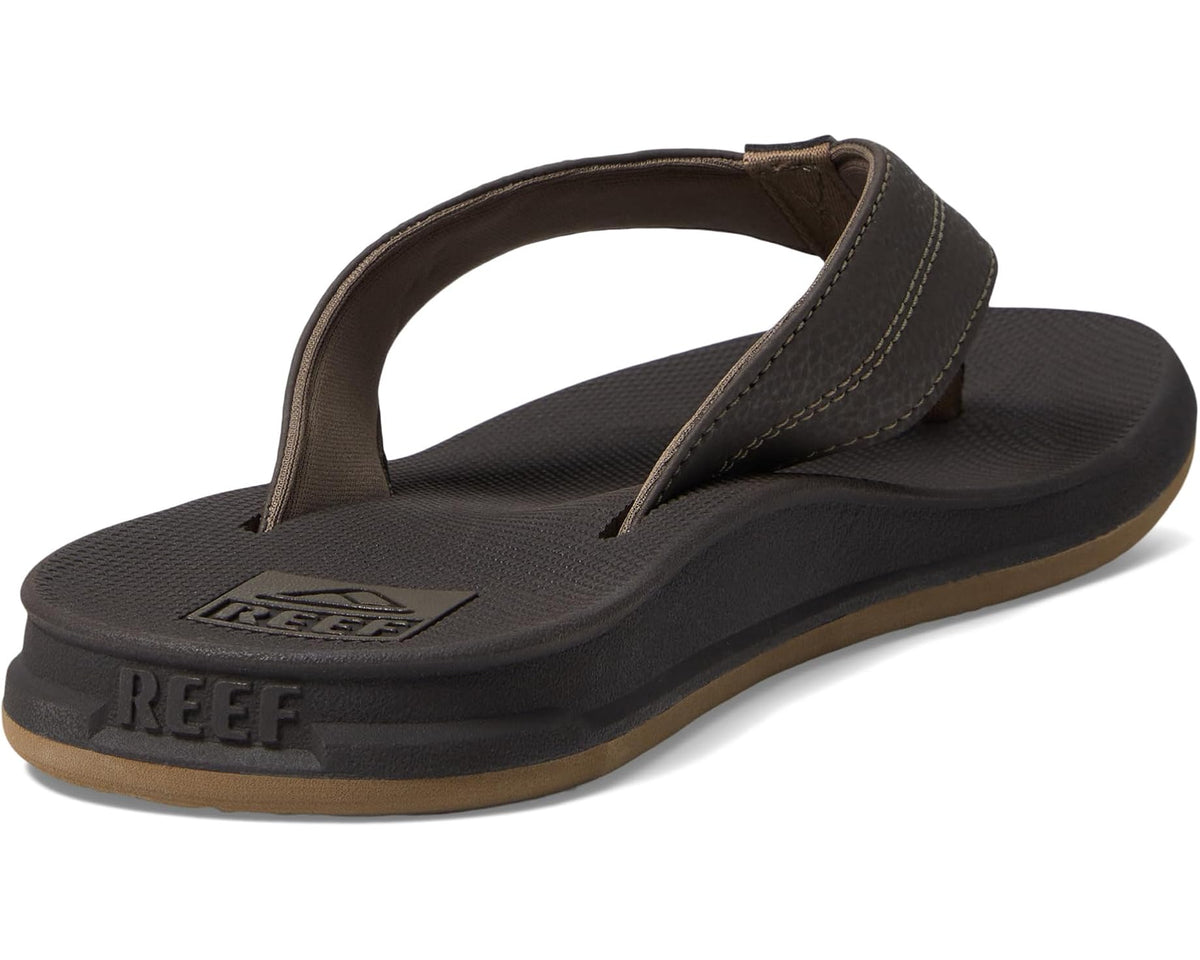 Men's brown flip-flops front view with embossed REEF logo on footbed.