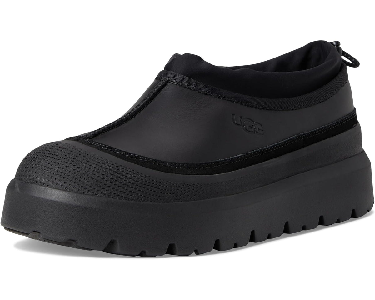 Black UGG slip-on boot with smooth upper, textured sole, and pull-tie collar