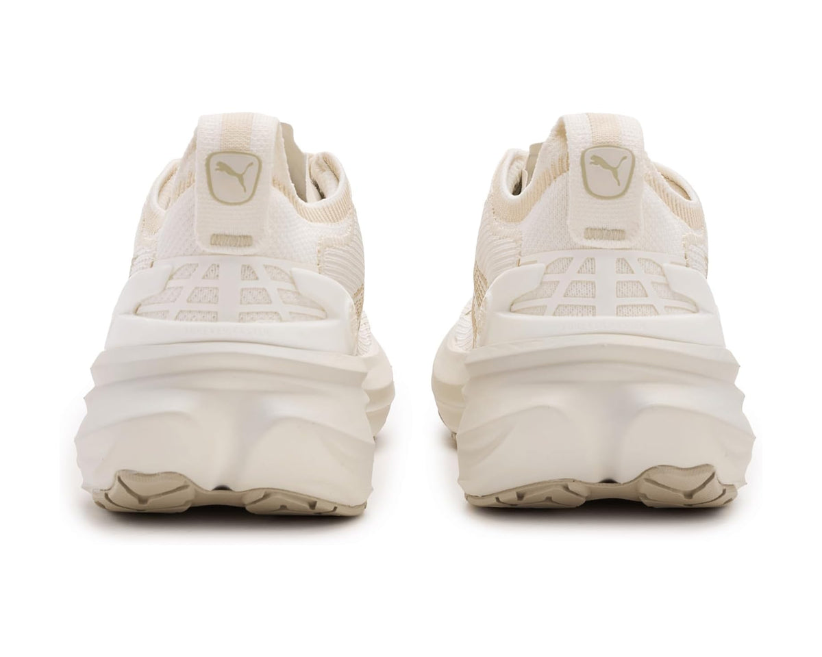 Back view of off-white running shoes with padded heel and molded rear logo