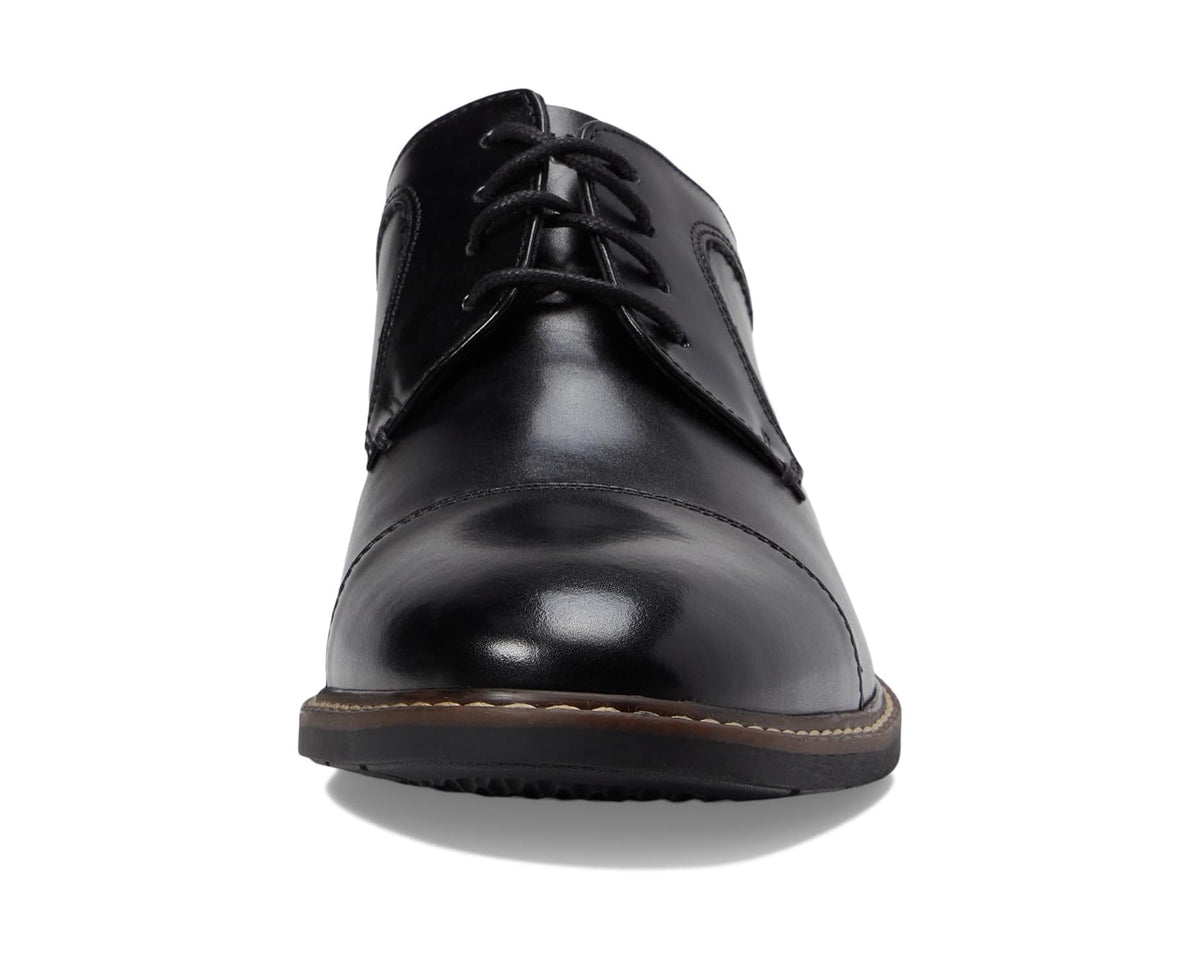 Black cap-toe Oxford shoe front view with lace-up and glossy finish