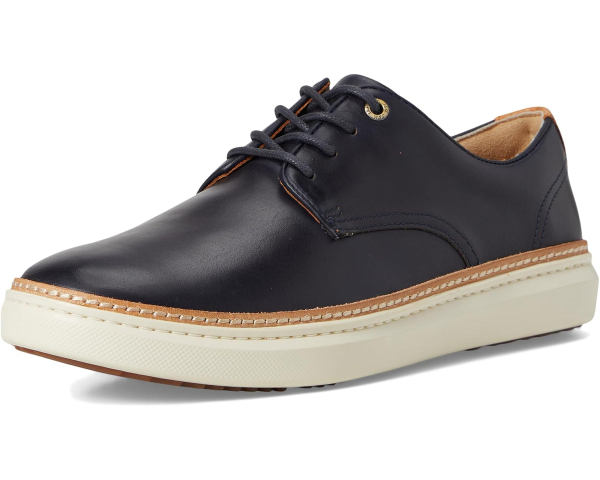 Men's dark navy plain-toe leather oxford with lace-up front and stitched cream trim