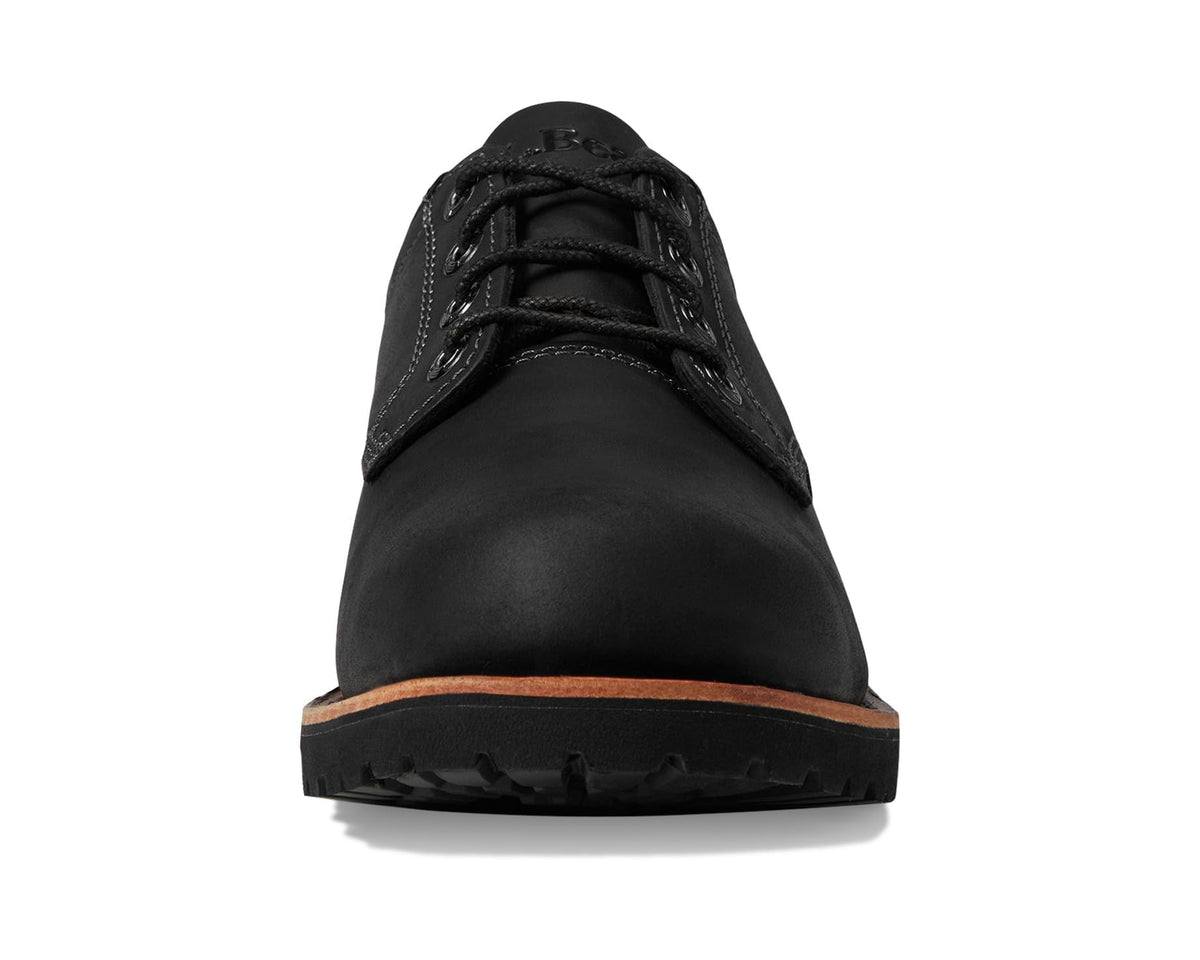 Black leather lace-up plain-toe shoe front with padded tongue and eyelets