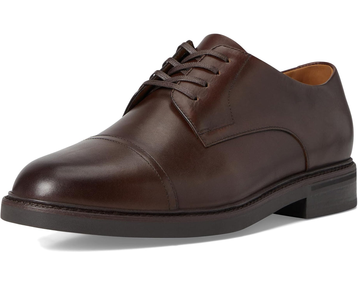 Brown leather lace-up cap-toe oxford shoe with padded collar and dark sole.